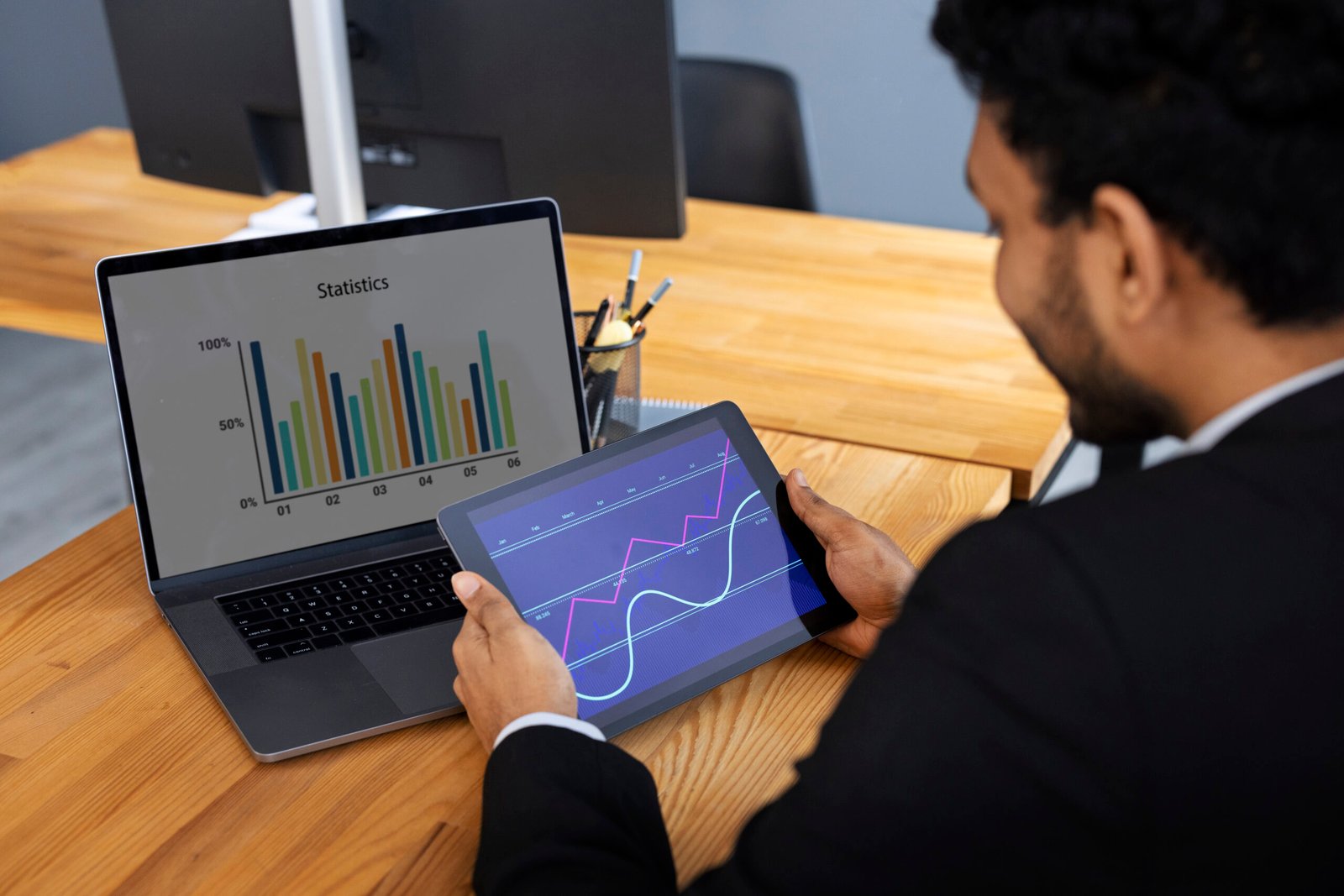 Beginner data analyst reviewing charts and dashboards on a laptop as part of the roadmap to becoming a Data Analyst in 2025.